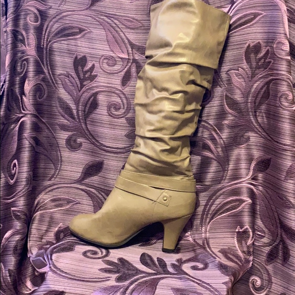 Brown knee high slouch boots with mid height heel